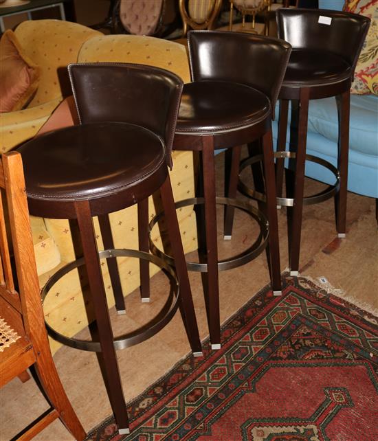 3 brown bar stools
